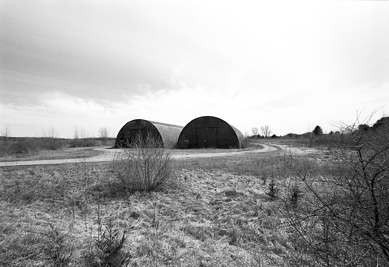 Two storage buildings lost in a slumbering prairie